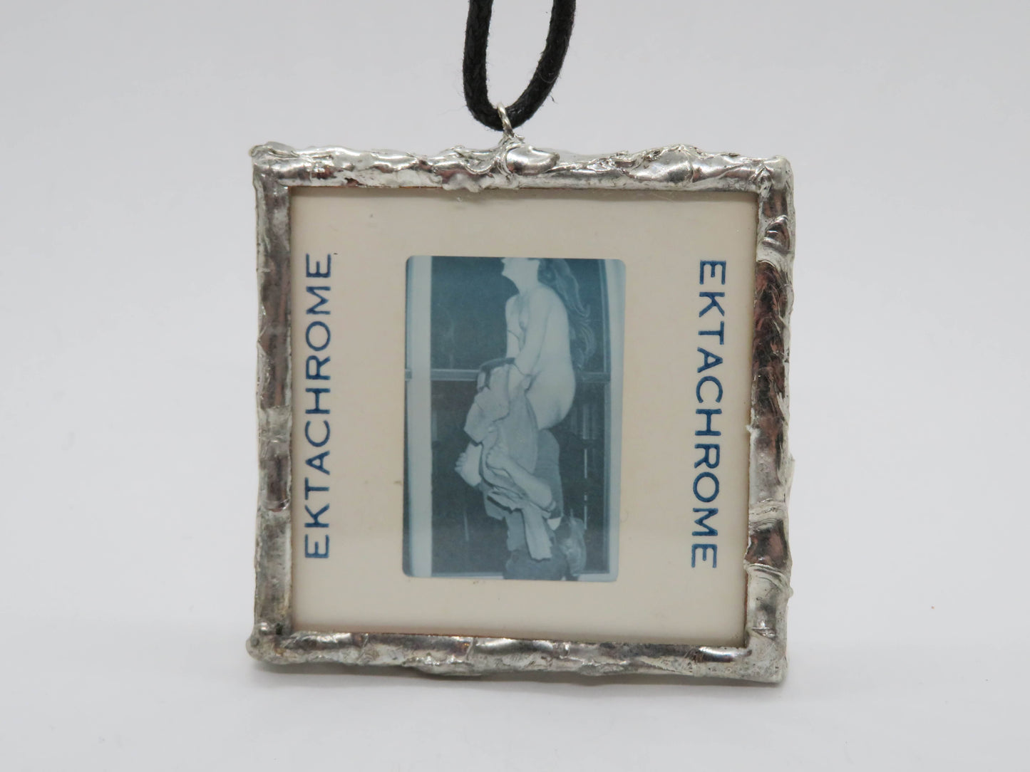 Slide Pendant of Nudist Couple