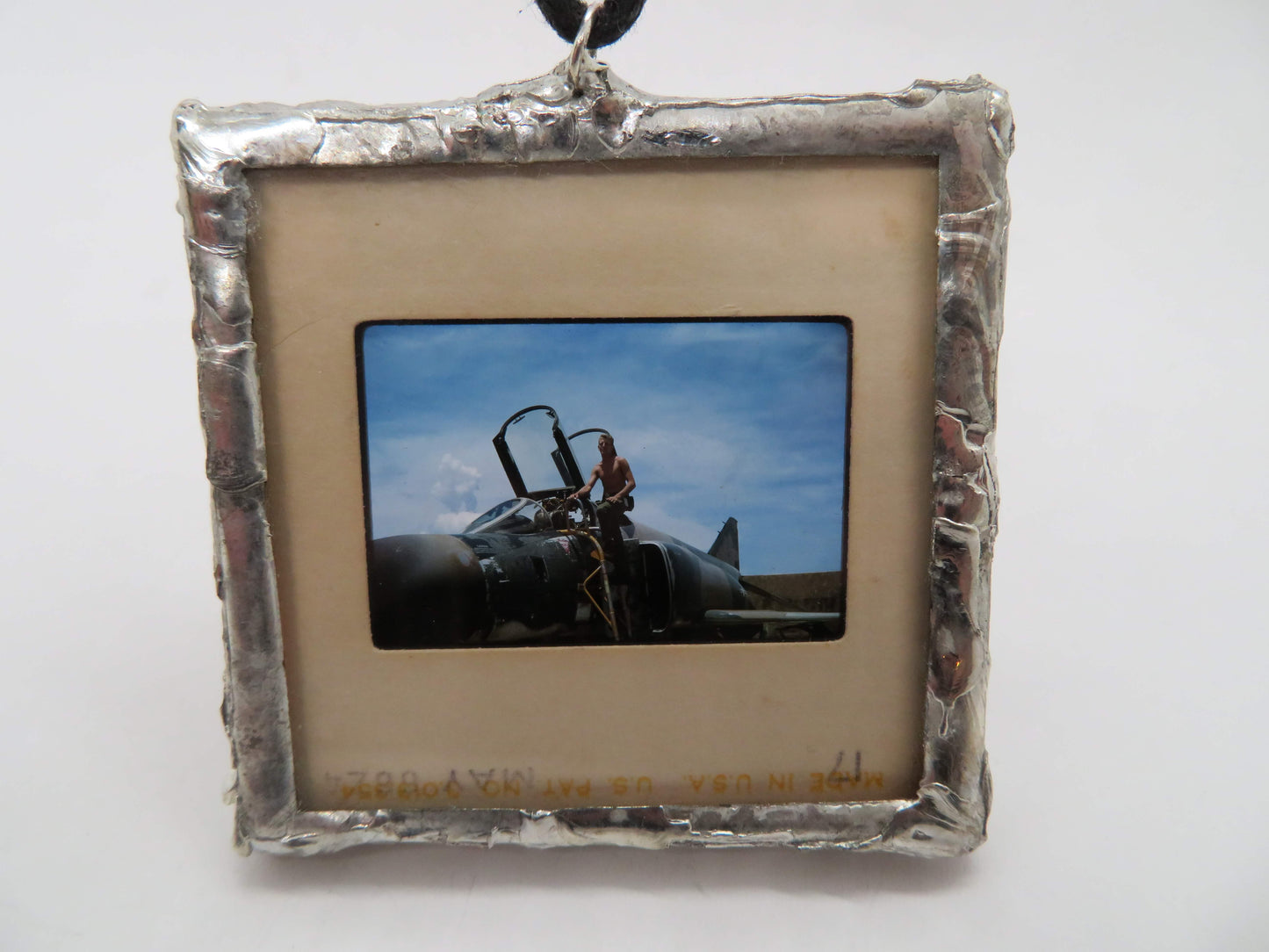 Slide Pendant of Vietnam Soldier Getting in Fighter Jet